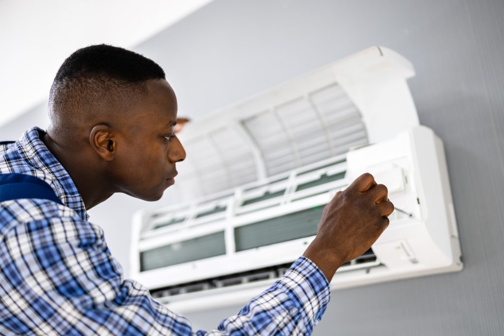 Air Conditioning Technician Repairing AC